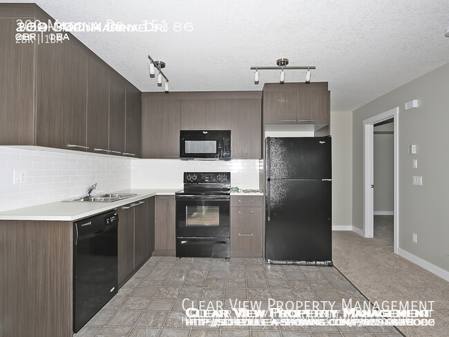 Building Photo - Chestermere Station 2 bedroom condo! ** Fi...