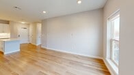 Located at 59 Mill St in Woburn, MA, this thoughtfully designed 2-bedroom, 3-bathroom residence offers a bright and modern living experience across a single floor. The open-concept living, dining, and kitchen area serves as the heart of the home, featuring light hardwood flooring, recessed lighting, and abundant natural light from large windows. The kitchen is appointed with crisp white shaker cabinetry, white subway tile backsplash, stainless steel appliances, and a central island with a striking marble-look countertop — ideal for both everyday cooking and entertaining. The primary bedroom is generously sized and includes access to a private balcony with outdoor views, offering a serene retreat. The second bedroom is well-proportioned, with large windows that bring in ample natural light and views of the surrounding neighborhood. Both feature light hardwood floors and neutral tones throughout. The three bathrooms are finished with clean, contemporary fixtures; one includes a walk-in tiled shower with brushed gold hardware, while another features a full tub-shower combo with white subway tile. Six closets provide excellent storage throughout. A dedicated laundry area and utility room add practical convenience to this well-appointed home.