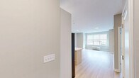 This thoughtfully designed two-bedroom, two-bathroom residence at 968 Bonnel Court, Unit 301 in Union, NJ offers a clean, modern aesthetic throughout its well-proportioned floor plan. Light wood flooring flows seamlessly across the entire unit, lending warmth and continuity to every room.

The open-concept kitchen and living area serves as the heart of the home. The kitchen is appointed with stainless steel appliances, including a gas range, microwave, and French door refrigerator, complemented by white upper cabinetry, two-tone lower cabinetry, and a subway tile backsplash. A large island with a quartz countertop and undermount sink provides additional prep space and casual seating. Pendant lighting above the island adds a contemporary touch. The adjacent living area benefits from large windows that invite abundant natural light.

Both bedrooms are generously sized with neutral-toned walls and windows overlooking the surrounding neighborhood. The primary bedroom is notably spacious and well-lit. The two bathrooms offer distinct finishes — one features elegant marble-style tile flooring and a glass-enclosed shower, while the second includes a soaking tub with a terrazzo-style surround. A dedicated closet provides practical storage. The unit's clean lines, modern finishes, and bright, airy atmosphere create a comfortable and contemporary living environment.