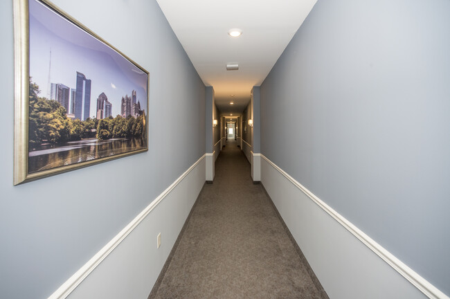 At the top of the stairs, hallway to the apartments - 9490 Transit Rd