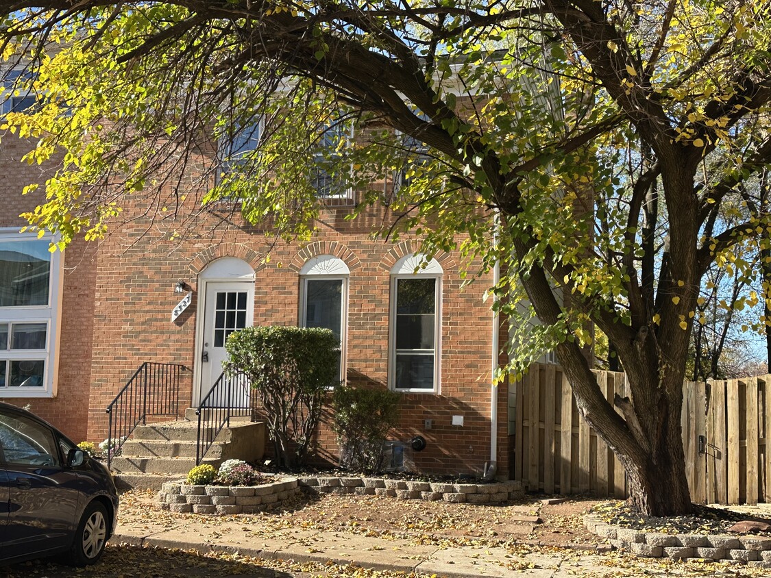 Front of the house with a patio door that leads to the ground floor private entrance - 8527 Piney Point Ct