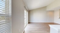 This 670 square foot apartment in Canal Winchester, Ohio offers a thoughtful layout maximizing space and functionality. The single-floor design features one bedroom measuring 130 square feet, providing a cozy retreat. The bathroom boasts a clean, modern aesthetic with a white bathtub, toilet, and light wood-look flooring.

The heart of the home is an open-concept kitchen and living area. The kitchen is equipped with stainless steel appliances, white cabinetry, and a practical breakfast bar, ideal for casual dining or additional workspace. Light-toned wood-look flooring extends throughout the main living areas, creating a seamless flow and enhancing the sense of space.

Large windows, including sliding glass doors, flood the interior with natural light and offer views of the outdoors. The living room provides ample space for comfortable furnishings and entertainment setup. Neutral wall colors throughout maintain a bright, airy feel.

Additional features include a hallway for easy navigation between rooms and a closet for storage. The overall design emphasizes efficiency and modern comfort, making this apartment an ideal choice for individuals or couples seeking a compact yet well-appointed living space.