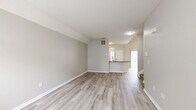 Located at 1929 Opal Street in Reynoldsburg, Ohio, this two-story home offers 2 bedrooms and 4 bathrooms across two thoughtfully laid-out floors. The main level features an open living room with light hardwood-style flooring, neutral painted walls, and a front entry door with sidelight windows that bring in natural light. The kitchen is a standout, showcasing dark granite countertops, white shaker cabinetry, a large peninsula with an undermount sink, and stainless steel appliances including a refrigerator, range, and microwave. A hallway connects the main living areas, and a half bathroom is conveniently located on this floor. The attached garage features a concrete floor, wood-framed walls, and an automatic garage door opener. Upstairs, the two bedrooms are carpeted and bathed in natural light from windows with blinds. The spacious primary bedroom includes a walk-in closet with built-in wire shelving. The bathrooms are finished with dark granite vanity tops, white cabinetry, and wood-look tile flooring; the primary bath includes a glass-enclosed walk-in shower. A dedicated closet and staircase complete the upper level, making this home functional and well-organized throughout.
