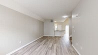 Located at 1929 Opal Street in Reynoldsburg, Ohio, this two-story home offers 2 bedrooms and 4 bathrooms across two thoughtfully laid-out floors. The main level features an open living room with light hardwood-style flooring, neutral painted walls, and a front entry door with sidelight windows that bring in natural light. The kitchen is a standout, showcasing dark granite countertops, white shaker cabinetry, a large peninsula with an undermount sink, and stainless steel appliances including a refrigerator, range, and microwave. A hallway connects the main living areas, and a half bathroom is conveniently located on this floor. The attached garage features a concrete floor, wood-framed walls, and an automatic garage door opener. Upstairs, the two bedrooms are carpeted and bathed in natural light from windows with blinds. The spacious primary bedroom includes a walk-in closet with built-in wire shelving. The bathrooms are finished with dark granite vanity tops, white cabinetry, and wood-look tile flooring; the primary bath includes a glass-enclosed walk-in shower. A dedicated closet and staircase complete the upper level, making this home functional and well-organized throughout.