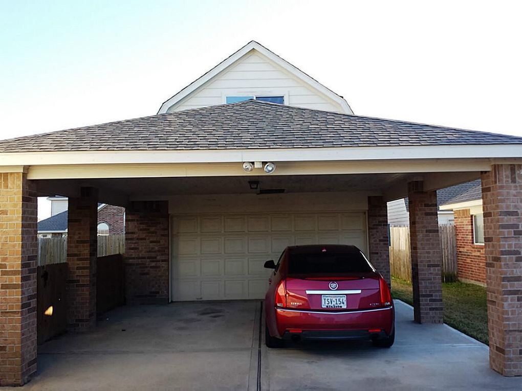 2 Car detached Garage with Covered Parking for 2 additional cars. 2 Story Storage (Man Cave/ Mother-law suite - unfinished at this time) - 11502 Grimes Ave.