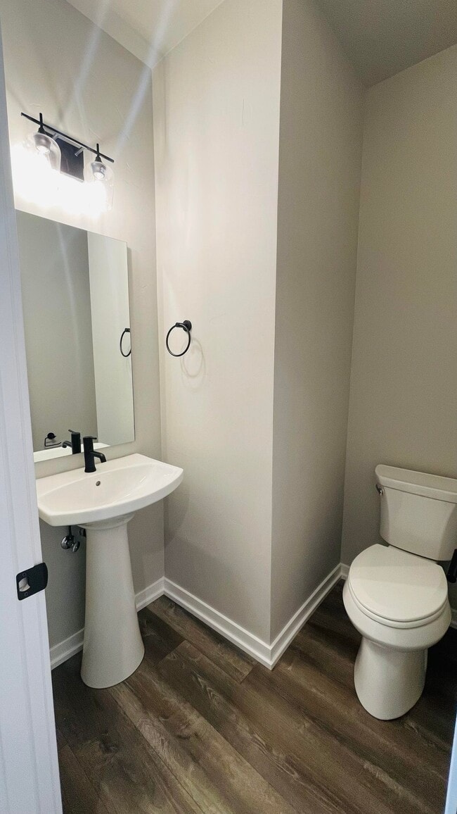 Half bath found off the living area on the first floor - 8150 SE Reddington St