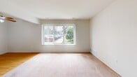 Located at 4575 Turner St in Trenton, Michigan, this two-bedroom, one-bathroom residence offers a practical and functional single-floor layout. The floor plan, as seen in the dollhouse view, reveals a logical flow between living spaces, hallways, a kitchen, and bedrooms. The spacious primary bedroom features soft carpeting, neutral walls, and a large window with vertical blinds that allows ample natural light and views of the surrounding greenery. The second bedroom is similarly finished with carpet flooring, a natural-light window, and a closet, making it well-suited as a guest room or home office. Both bedrooms are connected via carpeted hallways that provide easy circulation throughout the unit. The kitchen is equipped with wood-toned cabinetry, a stove, refrigerator, and hardwood-style flooring, offering a warm and utilitarian cooking space. The bathroom is cleanly appointed with tile flooring, a full soaking tub and shower combo, a granite-topped vanity, and a window that invites natural light and ventilation. Throughout the home, neutral tones and consistent finishes create a cohesive and move-in-ready atmosphere suited for a variety of residents.