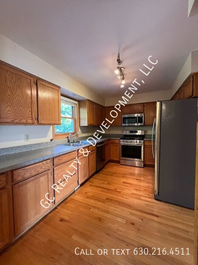 Building Photo - *** AURORA 4 BDRM - 2.5 BTH / FIN BSMT /EA...