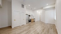 This 680 square foot single-story home in San Antonio, TX, offers a thoughtful blend of comfort and style. The property boasts two bedrooms, including a spacious primary bedroom of 140 square feet, and one bathroom. Throughout the home, light oak-toned flooring creates a warm, inviting atmosphere, complemented by crisp white walls that enhance the sense of space.

The living areas are characterized by an abundance of natural light, courtesy of large windows adorned with white blinds. A standout feature is the bay window area, providing a charming nook for relaxation or reading. The modern kitchen is equipped with sleek stainless steel appliances, including a French door refrigerator, range, and built-in microwave. White cabinetry with gold hardware and light wood lower cabinets offer ample storage and add to the contemporary aesthetic.

The bathroom showcases a luxurious feel with marble-effect tiling, a white bathtub, and gold-toned fixtures. The home's efficient layout includes a closet for additional storage. Despite its compact size, the property maintains an open and airy ambiance, making it an ideal choice for those seeking a low-maintenance yet stylish living space in the heart of San Antonio.