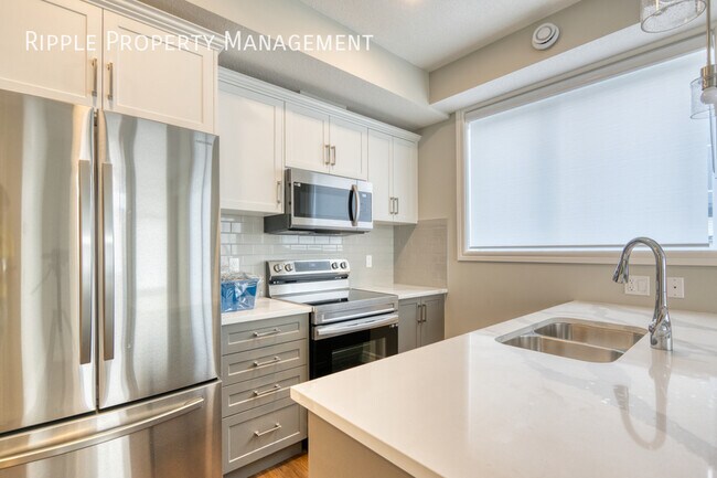 Photo du bâtiment - COZY 1 BED/ 1 BATH TOWNHOUSE IN THE COMMUNITY OF SADDLE RIDGE