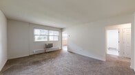 Located at 2819 Kate Ave in Bensalem, PA, this 3-bedroom, 1-bathroom unit offers a practical and well-organized single-floor layout. The kitchen is a standout feature, equipped with rich dark wood cabinetry, a mosaic tile backsplash, stainless steel appliances including a refrigerator, dishwasher, and electric range, and light wood-style vinyl plank flooring that extends into the adjoining dining area. A ceiling fan and windows allowing natural light enhance the open feel of this combined space.

The spacious primary bedroom offers generous room to accommodate large furnishings, with soft wall-to-wall carpeting and a window overlooking the exterior greenery. The two additional bedrooms are also carpeted and each feature sliding double-door closets, providing ample storage. Windows in the bedrooms invite natural light and views of the surrounding brick residential buildings.

The bathroom has been tastefully updated with large-format marble-style wall tiles surrounding a full soaking tub and shower combination, complemented by coordinating tile flooring for a clean, cohesive look. A connecting hallway links the rooms efficiently throughout the unit. Baseboard heating is present throughout, and a window AC unit provides additional climate control options.