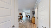 Located at 700 Lincoln Village Circle in Larkspur, CA, this one-bedroom, one-bathroom residence offers a thoughtfully designed single-floor layout with modern finishes throughout. Light hardwood-style flooring runs through the open living and dining areas, creating a bright, cohesive feel. The spacious living room features large sliding glass doors that invite natural light and provide access to the outdoors, complemented by crown molding and clean white walls that enhance the airy ambiance.

The kitchen is well-equipped with two-tone cabinetry—white upper cabinets and gray lowers—paired with quartz countertops, a white subway tile backsplash, stainless steel appliances, and a window above the sink that brings in additional natural light.

The carpeted primary bedroom is generously sized, featuring a ceiling fan, a large window with outdoor views, and a mirrored sliding-door closet that adds depth and storage. The room's calm, neutral palette creates a restful retreat.

The bathroom is finished with clean white subway tile surrounding a full soaking tub and shower combination, chrome fixtures, and light wood-tone flooring, striking a balance between classic and contemporary design.

Overall, this residence offers a comfortable and modern living environment in the desirable Marin County community of Larkspur.