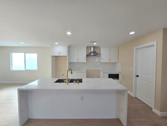 Building Photo - Beautifully Remodeled 4-Bedroom Home with ...