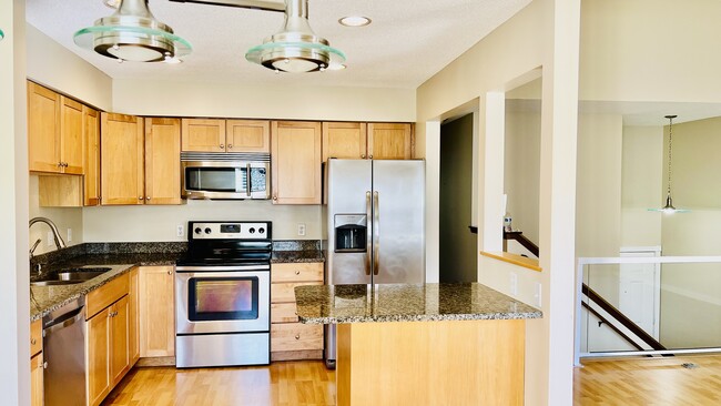 Kitchen with steel appliances and granite counter tops (10*10ft) - 4092 S Meadowlark Rd