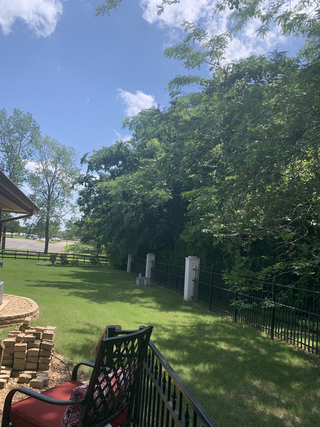 View of Pool area, tennis courts, walking trail, from patio - 614 Cooper Estates Dr