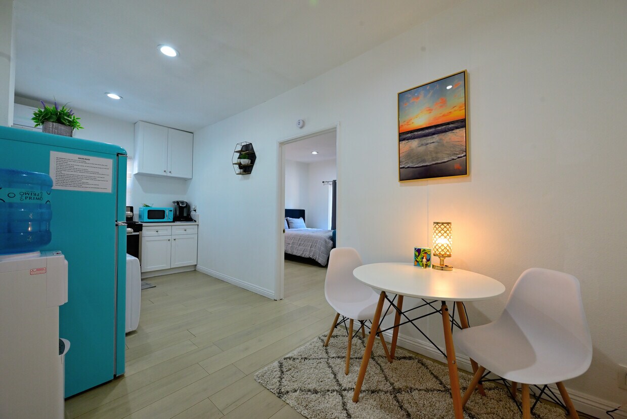 Fully furnished living room with upgraded kitchen, appliances, and laundry machines - 1489 E Colorado Blvd