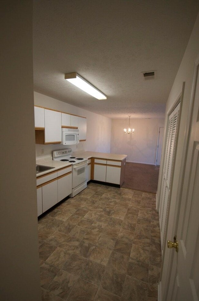 Kitchen to Hall - Bayfield Apartment Homes