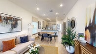 This two-story home offers a thoughtfully designed layout that blends functionality with modern style. The main living area features an open-concept floor plan where the living room, dining area, and kitchen flow seamlessly together. Light wood-look flooring runs throughout, complemented by recessed lighting and clean white walls that create a bright, airy atmosphere. Natural light streams in through multiple windows dressed with woven roman shades and blinds.

The kitchen is well-equipped with granite countertops, taupe shaker-style cabinetry, a full suite of stainless steel appliances, and a tiled backsplash. A peninsula with bar seating connects the kitchen to the dining area, which comfortably accommodates a full dining table. The front entry features a keypad-enabled door for added convenience and security.

The bedrooms are generously sized with wood-look flooring, ceiling fans, and natural light from well-positioned windows. The bathroom is finished with granite countertops, taupe cabinetry, large-format tile flooring, and a tiled shower enclosure with glass doors.

Outside, a private backyard enclosed by a full-height white vinyl privacy fence offers a quiet outdoor retreat with a well-maintained lawn — ideal for relaxation or entertaining.