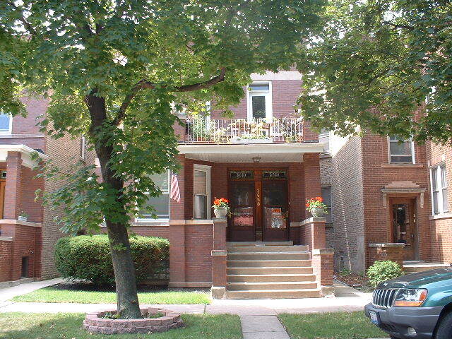Beautiful brown stoned 2-flat building. - 3650 N Oakley Ave