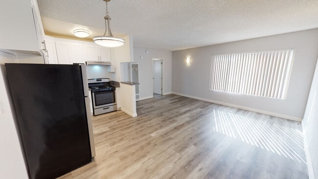 Living room - Berryman Apts...Newly Remodeled Apartments Available...Large Windows...Washer/Dryer in Unit!