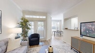 Located at 5500 Sampson St in Houston's 77004 corridor, this single-story, three-bedroom, two-bathroom home offers a well-designed layout that maximizes every square foot. The living area greets you with crown molding, light wood-look flooring, and a pair of French doors topped with transom windows that flood the space with natural light. A half-wall pass-through connects the living room to the kitchen, keeping the open-concept feel intact.

The galley-style kitchen is outfitted with stainless steel appliances—including a refrigerator, range, and microwave—granite-look countertops, and light wood cabinetry. The adjacent dining area benefits from a wall of windows overlooking greenery, creating a bright, inviting atmosphere for everyday meals.

The primary bedroom is generously proportioned, featuring a ceiling fan, large window, and access to a dedicated walk-in closet with built-in wire shelving. The additional bedrooms offer comfortable dimensions with ample natural light. Both bathrooms are finished with clean white vanities, framed mirrors, and wood-look tile flooring.

A dedicated laundry room houses a full-size washer and dryer alongside wire shelving for storage. Throughout the home, consistent wood-look flooring, neutral tones, and crown molding details create a cohesive and polished aesthetic.