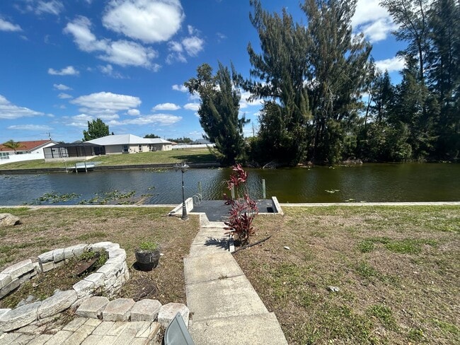 Building Photo - Freshly painted interior 2/2  spacious home on fresh water canal