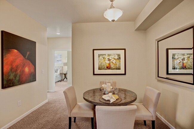 A cozy dining area with overhead lighting and easy access to the kitchen - Solara