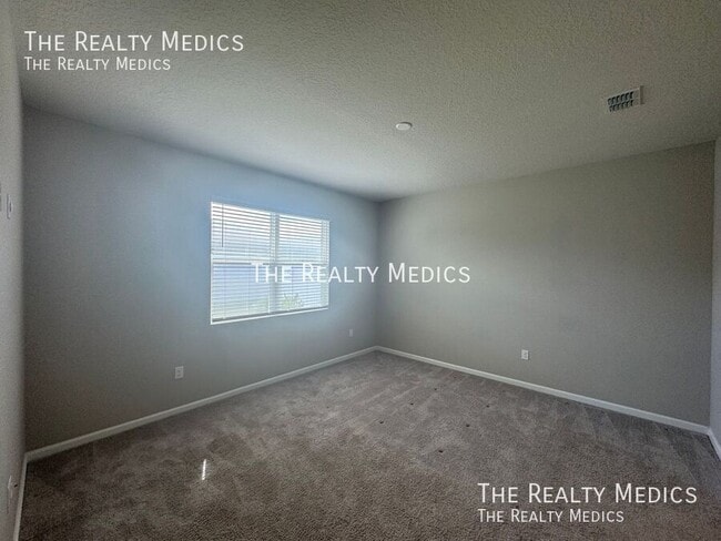 Building Photo - 5089 Meadow Song Dr