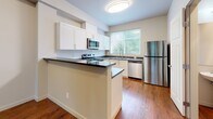 Located at 34626 SE Swenson Dr in Snoqualmie, WA, this three-bedroom, two-bathroom home spans three floors and offers a well-organized layout with plenty of storage throughout. The entry-level garage provides secure parking and utility space with a functional concrete floor and drywalled walls.

The main living floor serves as the heart of the home, featuring rich hardwood flooring that flows through a combined living, dining, and kitchen area. The living room is bright and open, with a large window framing views of the surrounding Pacific Northwest tree canopy. The kitchen is equipped with stainless steel appliances, including a full-size refrigerator and dishwasher, complemented by warm wood floors and ample cabinetry. A balcony extends the living space outdoors, ideal for enjoying the natural surroundings.

The upper floor houses the three bedrooms, each offering a comfortable and calm retreat. The primary bedroom is generously sized and features plush carpeting and its own closet. The additional bedrooms are equally well-appointed, with large windows that bring in natural light and lush green views. The two bathrooms are clean and bright — one featuring a double-sink vanity with a soaking tub and shower combo set on hardwood-style flooring. A dedicated laundry area and multiple closets throughout ensure excellent storage and everyday convenience.