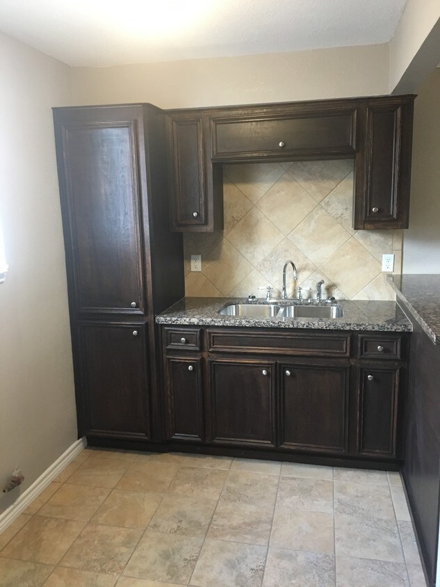 Kitchen. Stove and fridge coming soon - 5011 Paige St