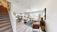 Located at 2601 Crystal Bend Dr in Pflugerville, TX, this well-designed two-story home offers three bedrooms, three bathrooms, a dedicated office, and a versatile layout spread across two floors. The main level features an open-concept living room and kitchen bathed in natural light from multiple windows. The kitchen is outfitted with white shaker cabinetry, stainless steel appliances, a tile backsplash, and light wood-look flooring that flows seamlessly into the dining and living areas. The living room is bright and airy, with a ceiling fan and generous window views of the surrounding neighborhood. Hallways on both floors are clean and well-lit, with recessed lighting and light hardwood-style flooring. Upstairs, the spacious primary bedroom features plush carpet, a ceiling fan, and a large walk-in closet with dual hanging rods. The three bathrooms are finished with white vanities and tiled tub-shower combinations. A dedicated laundry room with side-by-side washer and dryer hookups adds everyday convenience. The attached garage provides ample storage space. A dedicated office rounds out this functional and comfortable home, making it well-suited for a variety of lifestyles.