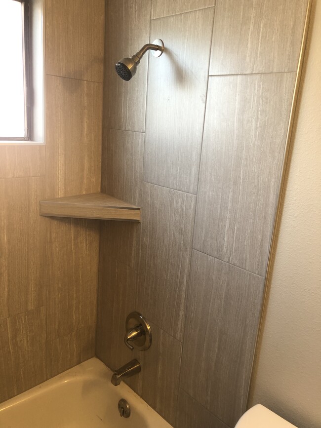 Tile shower - 2539 Grand Ave