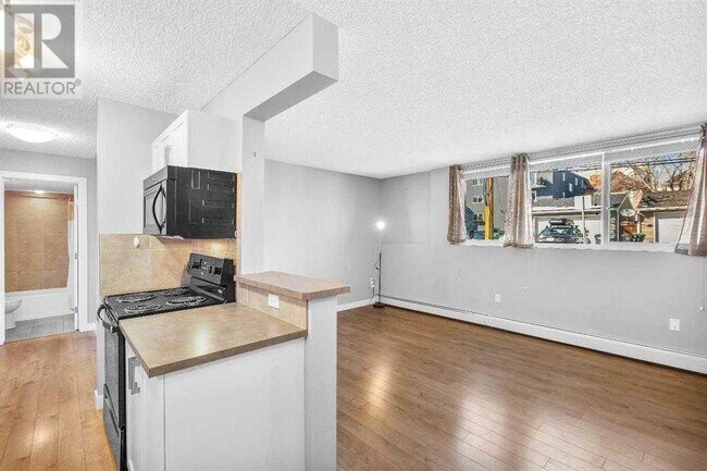 Photo du bâtiment - 110-124 24 Ave SW