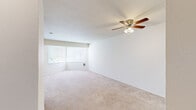 Located at 1533 Jackson Street in Oakland, CA, this one-bedroom, one-bathroom unit offers a practical and well-organized single-floor layout. The living room is a comfortable, carpeted space featuring a ceiling fan with light fixture and a window that brings in natural light, creating a bright and airy atmosphere. Clean white walls throughout lend a neutral, move-in-ready feel to the entire unit.

The bedroom is a well-proportioned room carpeted in the same warm neutral tones as the living area. A standout feature is the pair of large corner windows fitted with blinds, framing lush green tree views and flooding the room with natural light. A wall-mounted heating unit ensures year-round comfort. The bedroom also includes a full-width mirrored sliding-door closet with built-in shelving, maximizing both storage and the sense of space.

The bathroom is finished with tile flooring and features a white vanity with rich red-toned stone countertop, a framed mirror, and an overhead vanity light fixture, giving it a clean and polished look.

Overall, the unit offers a straightforward, functional design with consistent finishes, ample natural light, and practical storage — well-suited for comfortable everyday living in the heart of Oakland.
