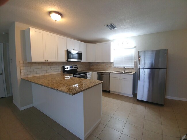 Kitchen view from living room - 4458 County Road 472