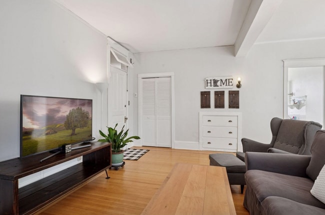 Second angle of living room, showing off main entrance, coat closet, and bonus entryway storage - 2601 Portland Ave