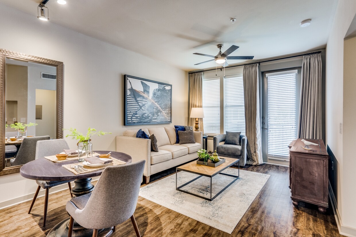 modern living room with wood plank flooring and natural lighting in Plano - Junction 15