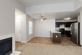 Located at 12800 SE 7th St in Vancouver, WA, this 2-bedroom, 1-bathroom single-floor residence offers a practical and well-designed layout. The open-concept living and kitchen area forms the heart of the home, where wood-look flooring flows through the kitchen while plush carpet extends into the living space. The kitchen is outfitted with rich dark-espresso cabinetry, white countertops, stainless steel appliances including a refrigerator and range, and a peninsula island that provides additional prep and seating space. A ceiling fan overhead adds comfort to the living area, which receives natural light through a window near the entrance.

A hallway connects the main living area to the private quarters. The spacious primary bedroom features carpet flooring, dual windows for natural light, and a baseboard heating unit. The second bedroom is similarly appointed with carpet, a window, and a closet with sliding doors. Both bedrooms are served by a shared full bathroom, which includes a dark-cabineted vanity, white countertop, a mirror, and a tub/shower combination with wood-look tile flooring. A dedicated closet and entrance area complete the thoughtfully organized floor plan.