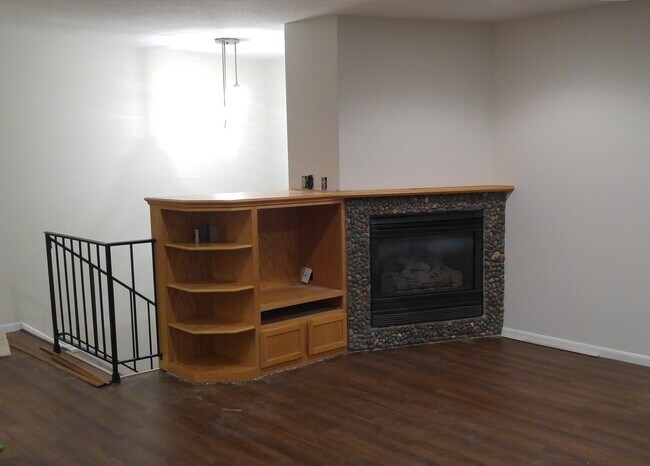 living room built-in with fireplace - 1800 Centennial Dr