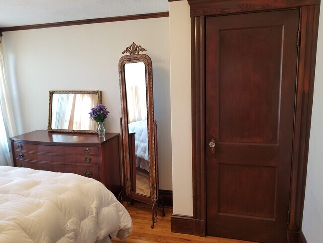 Furnished Bedroom with closet, dresser, lamp, and full length mirror - 12 Homer St