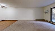 Located at 304 W North St in Waukesha, Wisconsin, this one-bedroom, one-bathroom unit offers a well-organized, single-floor layout designed for comfortable everyday living. The living area features neutral carpeting, baseboard heating, a ceiling fan, and a sliding glass door that brings in natural light and views of surrounding trees, creating a calm and inviting atmosphere. The galley-style kitchen is efficiently designed with warm oak cabinetry, dark speckled countertops, wood-look vinyl flooring, and a full suite of appliances including a stainless steel refrigerator, electric range, dishwasher, and an in-unit washer — a practical and convenient feature. A ceiling fan overhead adds to the kitchen's functionality. The generously sized bedroom offers plush carpeting, baseboard heating, and ample room for furnishings. A dedicated walk-in closet with wire shelving and wood-look flooring provides substantial storage space. The bathroom is clean and straightforward, featuring a full tub-shower combination, a toilet, and wood-look vinyl flooring. Throughout the unit, the neutral color palette and functional finishes create a cohesive, move-in ready environment suited for a variety of lifestyles.