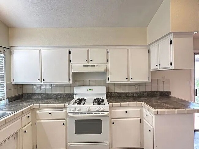 Building Photo - The entire home has new laminate flooring ...