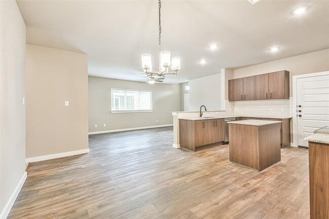 Building Photo - Modern 3-Bedroom Duplex with Granite Counters, Private Yard, and Prime Location
