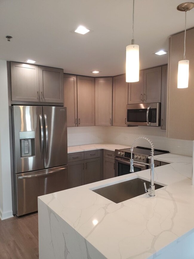 Building Photo - Renovated, centrally located and with lots...