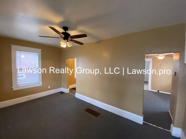 Building Photo - Updated Three Bedroom with Flat Yard