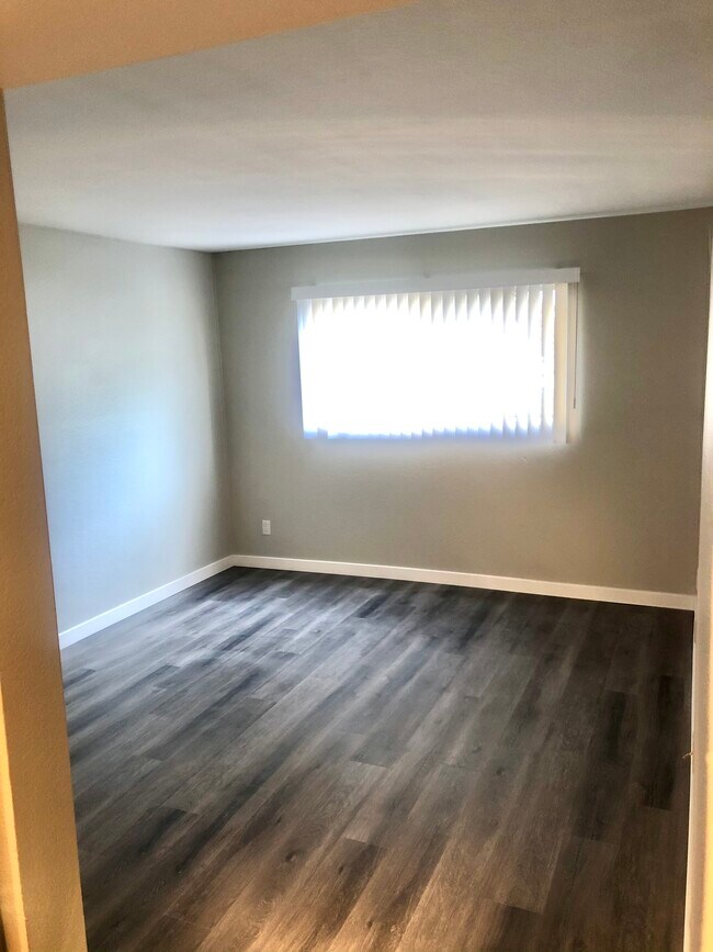 Master bedroom with bathroom and closet around the corner and behind the photographer - 449 Oak St