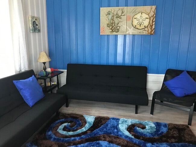 Living room with flat screen TV. - 5420 Hampton Cir
