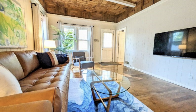 Poly & Bark soda with Room and Board coffee table, this home is comfy and has everything you need! - 310 Toronto St