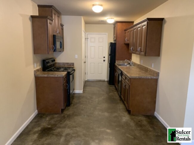 Building Photo - The Oaks - Water &amp; Sewer Included