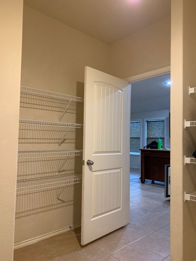 Laundry room with double wall shelving - 15327 English River Loop